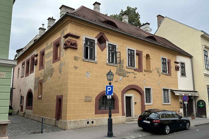 Buda Castle Tour: History and Architecture - Tárnok Street: medieval merchants under Gothic façades
