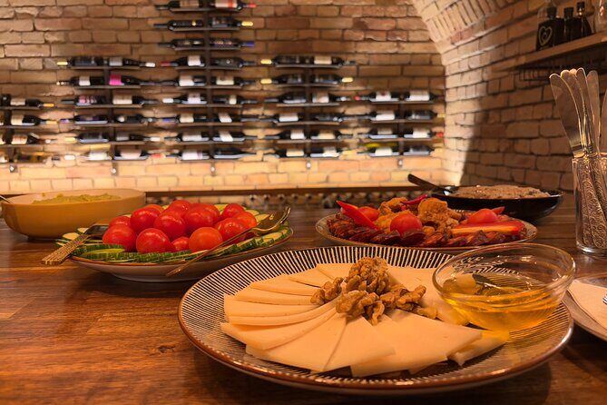 Budapest Wine Tasting and Heritage Experience at Goldcentral - Snacks and pairings: cheese, bread, dried fruit that keep pace